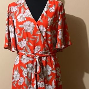 Orange romper with snap front with flowers size M
